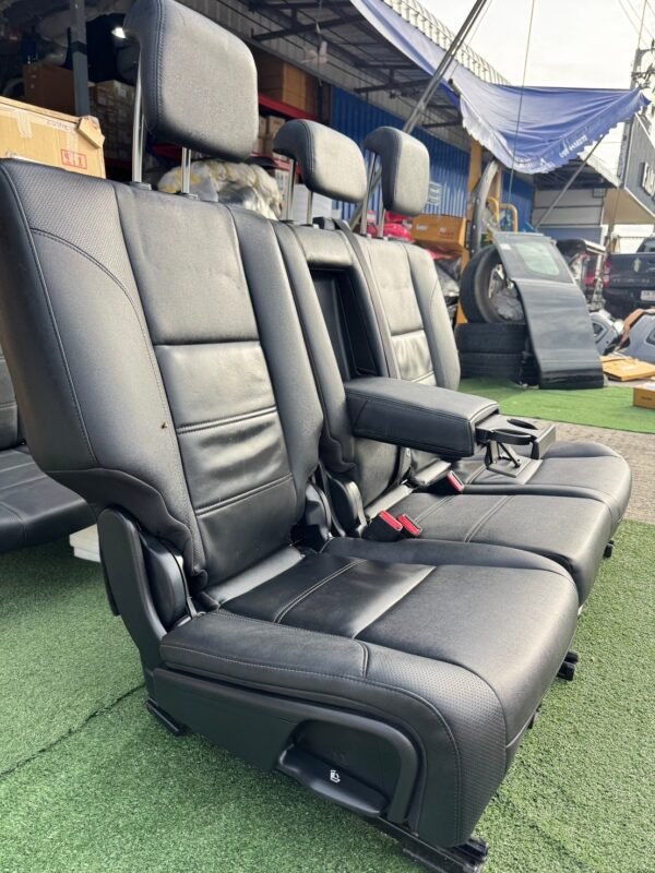 Genuine leather car seat set removed from Ford Everest 2020 (take-off condition). This complete second and third-row seat assembly includes integrated headrests, seat belts, center armrest with cup holders, and original rails for direct fitting - Image 3